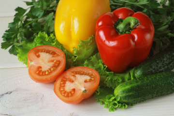 Raw vegetables and herbs: lettuce, sweet pepper, cucumber, chinese cabbage ... Concept healthy food