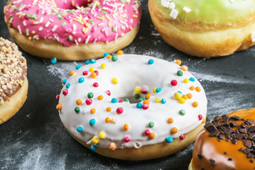 donuts with different fillings on a black background