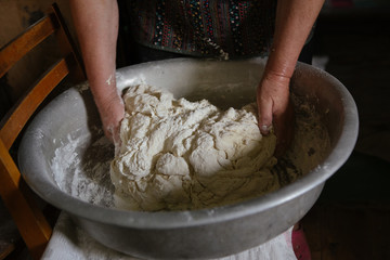 Making dough by female hands at home