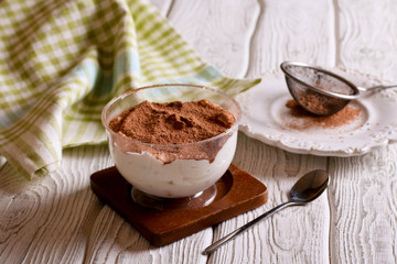 Tiramisu, traditional Italian dessert in glass