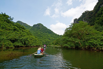 Fototapeta na wymiar Tourist boat on terrestrial halong bay, Trang An, Ninh Binh, Vietnam