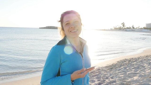 Sporty fitness woman on beach