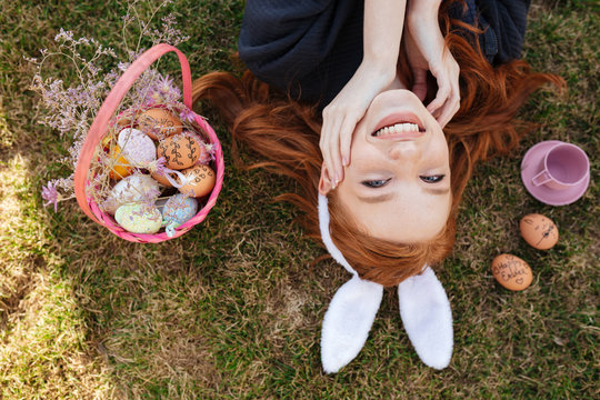 Top view portrait of a smiling happy red head girl