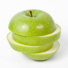 Fototapeta na wymiar Sliced green apple isolated on white background