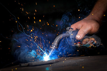 Worker welding theiron