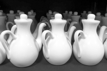 Rows of white ceramic jugs 