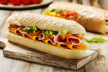 Traditional Italian sandwich with ham and cheese served warm.