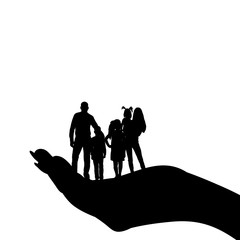 silhouette of a family with children in the palm of your hand, caring