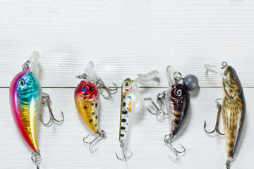 Fishing accessories on a wooden background. © Alex Ishchenko