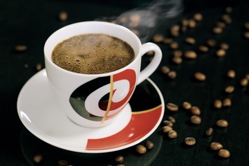 Cup of coffee on black background