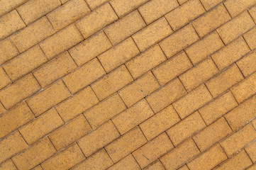 Grey yellow cobble stone pavement background