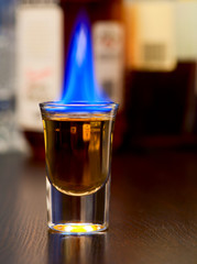 Flaming cocktail on a bar counter