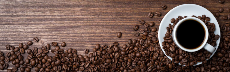 White coffee cup on an old wooden table. Food background