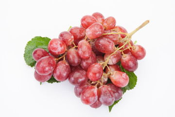 Ripe red grape with leaves isolated on white