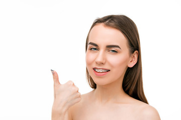 Obraz na płótnie Canvas Beautiful young woman with teeth braces