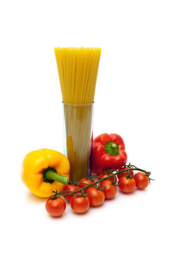 Vegetables and spaghetti on white background.