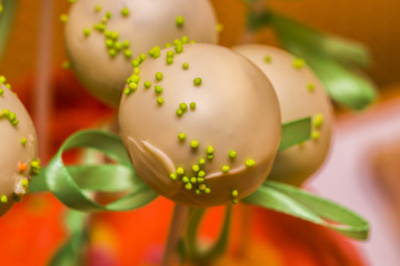 Top view photo of colorful cake pops on table