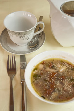 Gravy Soup in a White Ceramic Bowl Isolated