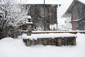 Walk in the village under a heavy snowfall