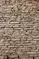 Natural grunge brown stone wall background and texture.
