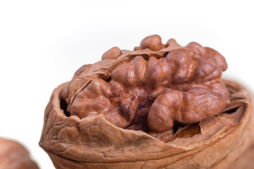 Shelled walnuts on a white background. Isolated. Dried nuts. Close up.
