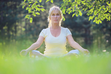 Yoga woman in the park