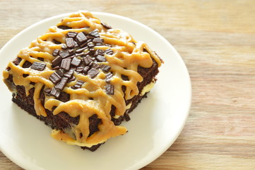 chocolate butter cake dressing brown sweet caramel cream on plate