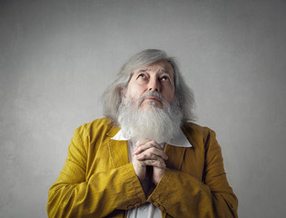 Praying elderly man
