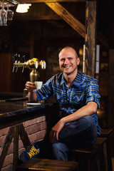 handsome young man drinking coffee while sitting at bar counter.enjoying coffee,Cafe Coffee Caffeine Casual Relaxation Style Concept.Young fashion man / hipster drinking espresso coffee in city cafe