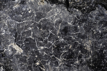 Abstract black stone  background with cracks