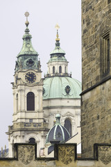 Fototapeta na wymiar The tower of St Nicholas Church (Cathedral) in Prague, Capital of Czechia.
