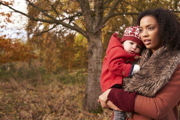 Young Girl On Autumn Walk With Mother