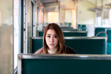 Young traveler woman on the train.