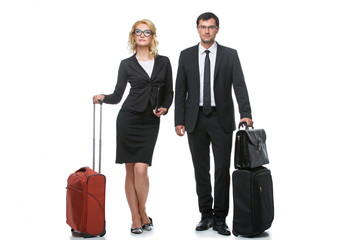 Businessman and business woman with travel cases