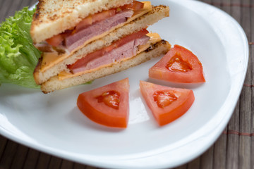 sandwich with cheese, tomato and smoked meat