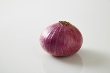 Red onions on Gray granite slab