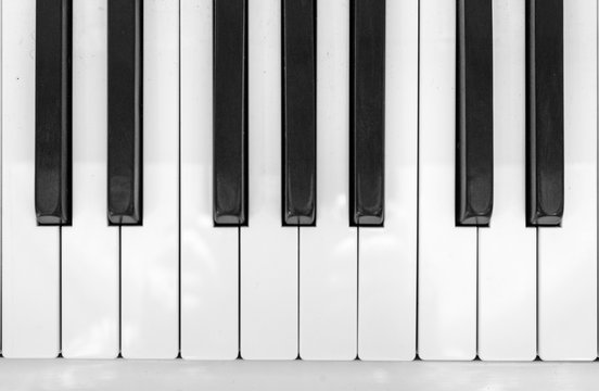 Frontal close-up view of piano keys.