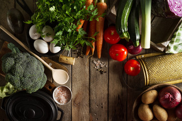 Cooking Healthy Vegetable Detox Concept with Various Vegetables, Cooking Pot on Kitchen Table, Kitchen Background. Top View with Copy Space.