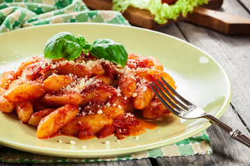 Italian gnocchi with tomato sauce and cheese