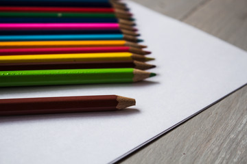 a row of colored pencils folded