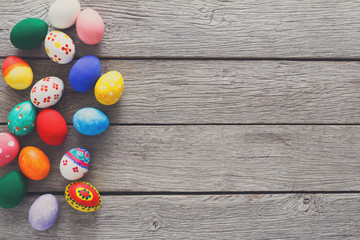Colorful easter eggs on wood background