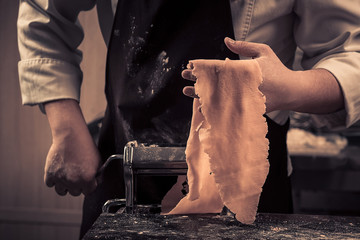 The chef makes fresh spaghetti from scratch.