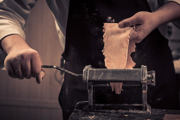 The chef makes fresh spaghetti from scratch.