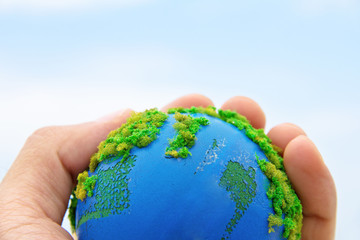concept image of Earth in hand