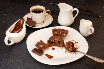 Chocolate french dessert cake mi-cuit on white plate