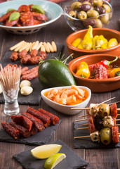 Spanish tapas appetizers on wooden table