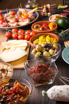 Spanish tapas appetizers on wooden table