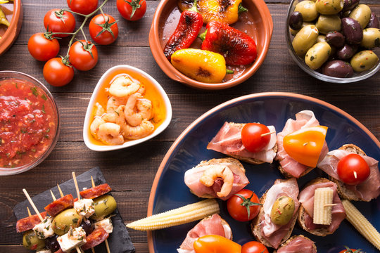 Spanish tapas appetizers on wooden table