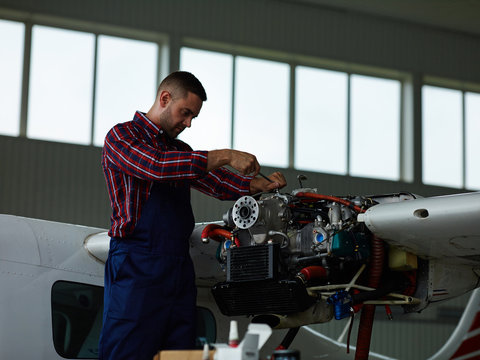 Modern engineer carrying out fixing work