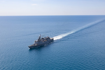 Fototapeta na wymiar Grey modern warship, helicopter view
